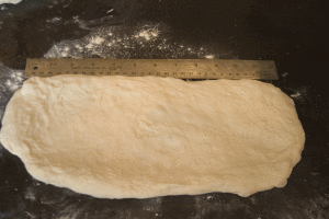 Cook's dough pressed into rectangle