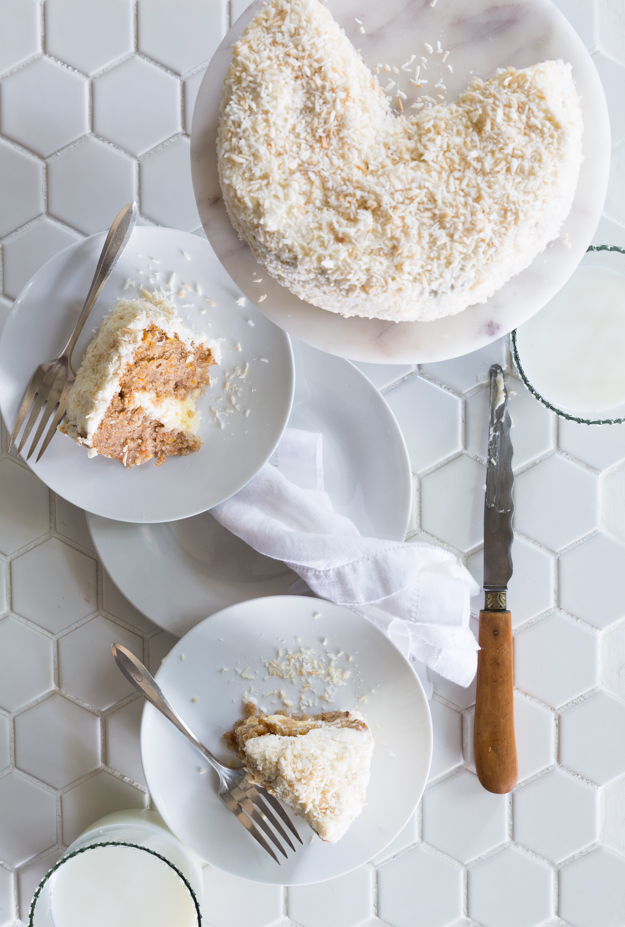 This image has an empty alt attribute; its file name is coconut-covered-cake-cut_-1.jpg