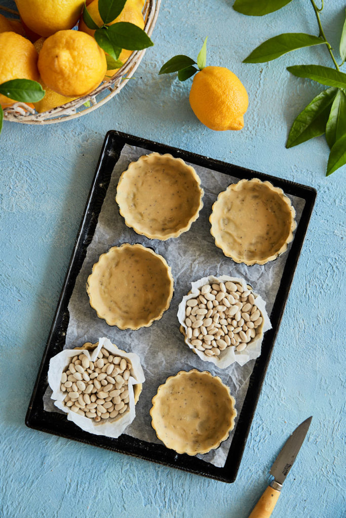 Blind baking tart shells using dried beans as pie weights
